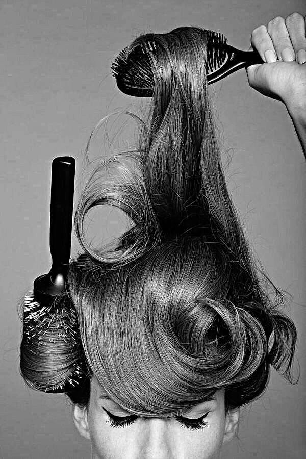 Long hair being brushed out with round brushes